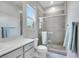 Bright bathroom features a glass-enclosed shower, vanity with storage, and a contemporary design at 3005 Merlesco Ave, Henderson, NV 89044