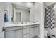 Modern bathroom with double sinks and decorative shower curtain at 3005 Merlesco Ave, Henderson, NV 89044