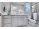 Modern bathroom featuring a spacious vanity, updated fixtures, and a glass-enclosed shower with stylish tile at 3005 Merlesco Ave, Henderson, NV 89044