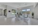 Bright dining room featuring modern table, chairs, and view of the backyard at 3005 Merlesco Ave, Henderson, NV 89044