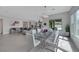 Open concept dining and living space with modern decor and ample natural light at 3005 Merlesco Ave, Henderson, NV 89044