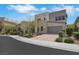 Modern two-story home with neutral color palette, desert landscaping, and a two-car garage at 3005 Merlesco Ave, Henderson, NV 89044