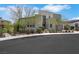Contemporary home with desert landscaping, including mature trees and shrubbery around the front yard at 3005 Merlesco Ave, Henderson, NV 89044