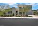Contemporary home showcasing well-maintained landscaping and a brick-paved driveway leading to an attached garage at 3005 Merlesco Ave, Henderson, NV 89044