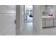 Hallway connecting to the main bath features access to the laundry room and other spaces at 3005 Merlesco Ave, Henderson, NV 89044