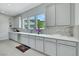 Bright kitchen showcasing countertops, mosaic backsplash, stainless steel appliances, and plenty of natural light at 3005 Merlesco Ave, Henderson, NV 89044