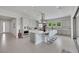 Open-concept kitchen featuring a large island with seating, stainless steel appliances, and ample counter space at 3005 Merlesco Ave, Henderson, NV 89044