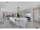 Large kitchen features a center island with seating, stainless steel appliances, and is open to the living area at 3005 Merlesco Ave, Henderson, NV 89044