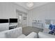Bright, modern living area with neutral colors, stylish decor, and a glimpse into the entryway at 3005 Merlesco Ave, Henderson, NV 89044