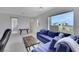 This modern living room features a large window and comfortable seating at 3005 Merlesco Ave, Henderson, NV 89044