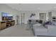 Comfortable living room with a gray sectional sofa, entertainment center, and stylish decor at 3005 Merlesco Ave, Henderson, NV 89044