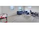 The living room features a cozy sectional, a desk, and an air hockey table at 3005 Merlesco Ave, Henderson, NV 89044