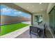 Covered patio featuring brick pavers, and views of the artificial turf at 3005 Merlesco Ave, Henderson, NV 89044