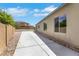 Side yard features a concrete walkway and low maintenance landscaping at 3005 Merlesco Ave, Henderson, NV 89044