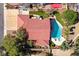 Aerial perspective showcasing a home's backyard oasis with a sparkling blue pool and lush landscaping at 3396 Montessouri St, Las Vegas, NV 89117