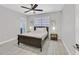 Bright bedroom features tile floor, ceiling fan, and a comfortable bed with bedside tables at 3396 Montessouri St, Las Vegas, NV 89117