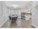 Bright dining area with large windows and a view of the kitchen's breakfast bar at 3396 Montessouri St, Las Vegas, NV 89117