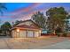 Spacious three-car garage with ample parking and well-maintained landscaping at 3396 Montessouri St, Las Vegas, NV 89117
