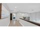 Upstairs hallway boasts built-in shelving, wood floors, and a view of a bathroom at 3396 Montessouri St, Las Vegas, NV 89117