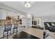 Bright kitchen with white cabinets, granite counters, stainless steel appliances, and breakfast bar with seating at 3396 Montessouri St, Las Vegas, NV 89117