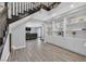 Spacious living room featuring tile floors, white built-ins, and a staircase to the second floor at 3396 Montessouri St, Las Vegas, NV 89117