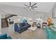 Open-concept living room with high ceilings and views of the staircase and kitchen at 3396 Montessouri St, Las Vegas, NV 89117