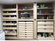 Custom pantry with microwave, pull-out drawers, adjustable shelving, and ample storage for all kitchen necessities at 3396 Montessouri St, Las Vegas, NV 89117