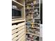 Custom pantry shelving maximizes storage space with pull-out drawers and dedicated spice racks at 3396 Montessouri St, Las Vegas, NV 89117