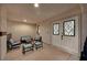 Inviting patio with cushioned seating, a coffee table, and lovely double doors at 3396 Montessouri St, Las Vegas, NV 89117