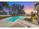 Enjoy the sparkling pool, lounge area, and lush landscaping in this backyard retreat at 3396 Montessouri St, Las Vegas, NV 89117
