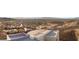 A high-altitude view captures a residential neighborhood with an expansive landscape in the distance at 350 Solitude Peak Ln, Henderson, NV 89012