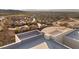 Aerial view features rooftop living and the surrounding golf course community with mountain backdrop at 350 Solitude Peak Ln, Henderson, NV 89012