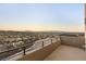 Spacious balcony with wrought iron railing offers panoramic views of the city and surrounding mountains at 350 Solitude Peak Ln, Henderson, NV 89012