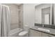 Bathroom featuring a granite vanity, a toilet, and a bathtub with shower, combining style and utility at 350 Solitude Peak Ln, Henderson, NV 89012