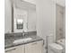 Modern bathroom features granite countertop, sleek vanity, and tiled shower-tub combination at 350 Solitude Peak Ln, Henderson, NV 89012