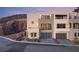 Striking three-story modern home with a three car garage and landscaped front yard at 350 Solitude Peak Ln, Henderson, NV 89012