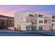 Stylish multi-level home featuring balconies, a two-car garage, and clean, modern lines at 350 Solitude Peak Ln, Henderson, NV 89012