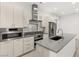 Contemporary kitchen featuring sleek cabinetry, stainless steel appliances, and a central island at 350 Solitude Peak Ln, Henderson, NV 89012