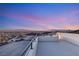 Expansive rooftop deck offers breathtaking city views with a sleek, modern design and comfortable lounging space at 350 Solitude Peak Ln, Henderson, NV 89012
