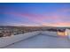 Sweeping panoramic views from the rooftop terrace showcase city lights and distant mountains at 350 Solitude Peak Ln, Henderson, NV 89012