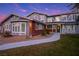 Charming two-story home featuring unique architectural detail and a well-manicured front lawn at 3531 W Arby Ave, Las Vegas, NV 89118