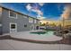 Backyard pool and spa area designed with rocks and a spacious patio area at 3531 W Arby Ave, Las Vegas, NV 89118