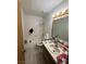 Bathroom featuring a standard tub, toilet, and a vanity with a mirror and lighting fixtures at 3585 Arville St # 401A, Las Vegas, NV 89103