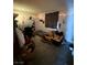 Cluttered bedroom interior with a door to the outside, white board and chair at 3585 Arville St # 401A, Las Vegas, NV 89103