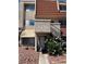 Two-story home with desert landscaping, red tile roof, and a private entrance via outdoor stairs at 3585 Arville St # 401A, Las Vegas, NV 89103