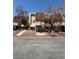 Exterior view showcasing the red rock landscaping and multiple townhome units with unique entryways at 3585 Arville St # 401A, Las Vegas, NV 89103