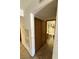 Hallway view leading to the bathroom with tiled flooring and a sliding closet door at 3585 Arville St # 401A, Las Vegas, NV 89103