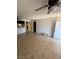 Unfurnished living room featuring tiled floors, an open layout, and a view towards the entrance door at 3585 Arville St # 401A, Las Vegas, NV 89103