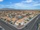 Expansive aerial view of a suburban neighborhood with well-maintained homes and mountain views at 3604 N Campbell Rd, Las Vegas, NV 89129