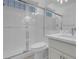Bright bathroom featuring glass enclosed shower, tile surround, toilet, and vanity with marble countertop at 3604 N Campbell Rd, Las Vegas, NV 89129